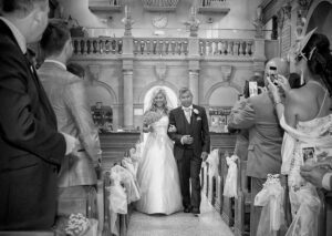 Bride in aisle Essex wedding day