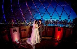 Trinity-Buoy-Wharf-wedding-couple-in-lighthouse-at-night