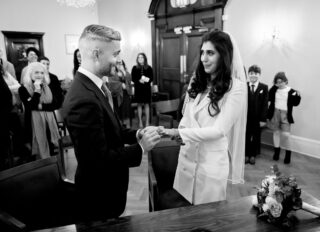 Exchange of rings at Chelsea Old Town Hall wedding ceremony