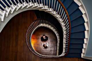 Clissold House Wedding bride and groom below stairs image