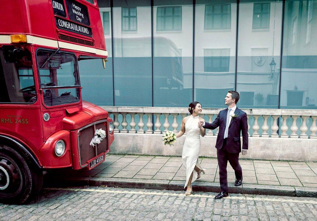Old Marylebone Town Hall wedding couple walk to London bus