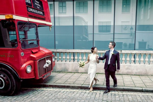 Old Marylebone Town Hall wedding couple walk to London bus