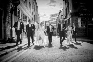 Shoreditch wedding party in street by Old Blue Last pub
