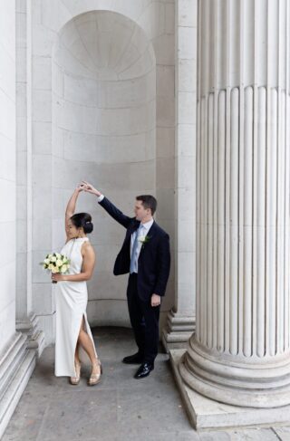 Wedding couple dance outside Old Marylebone Town Hall