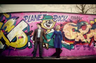 Engagement shoot couple in front of graffiti Alexandra Palace