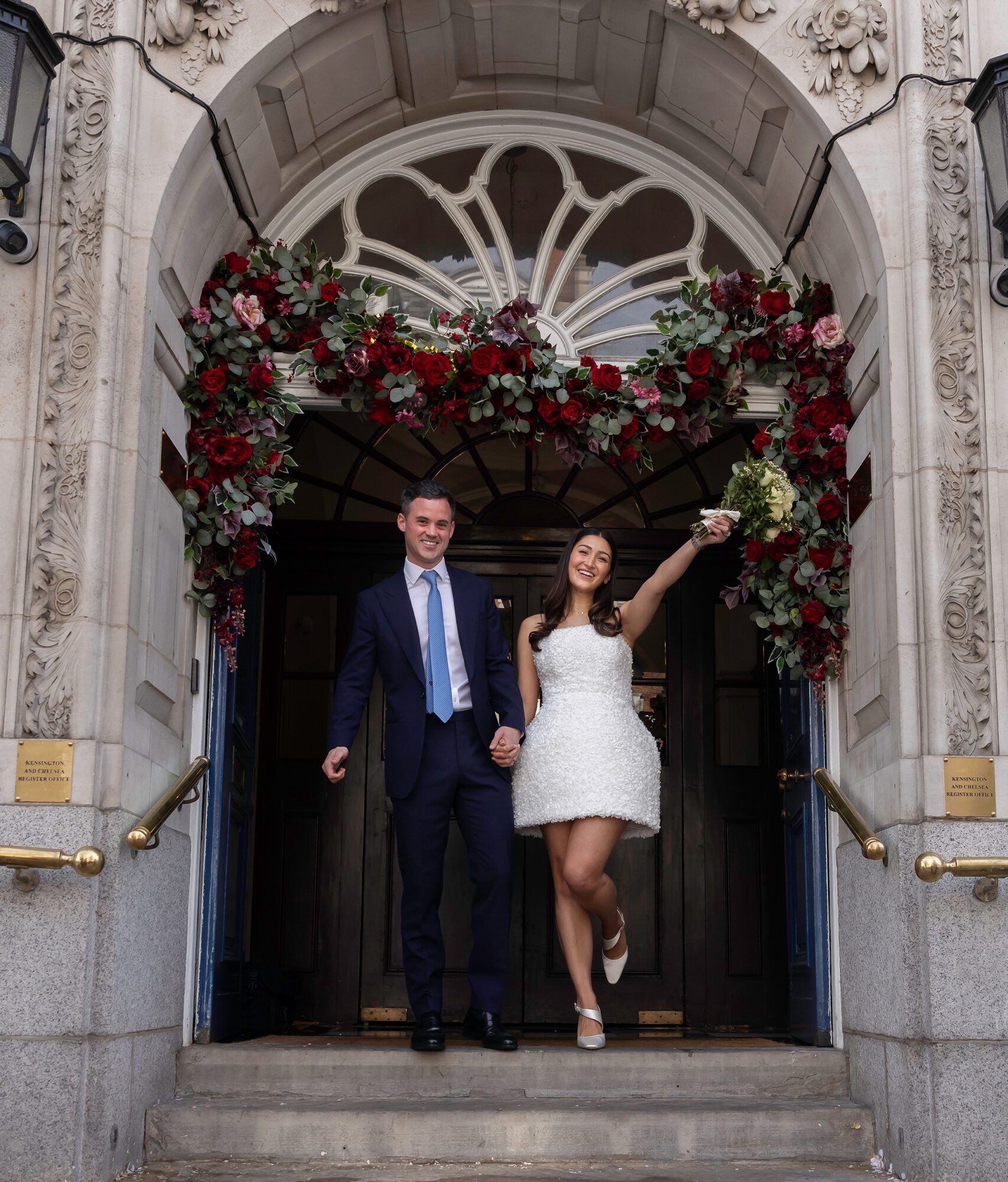 Bride and groom leaving Chelsea Old Town Hall Wedding