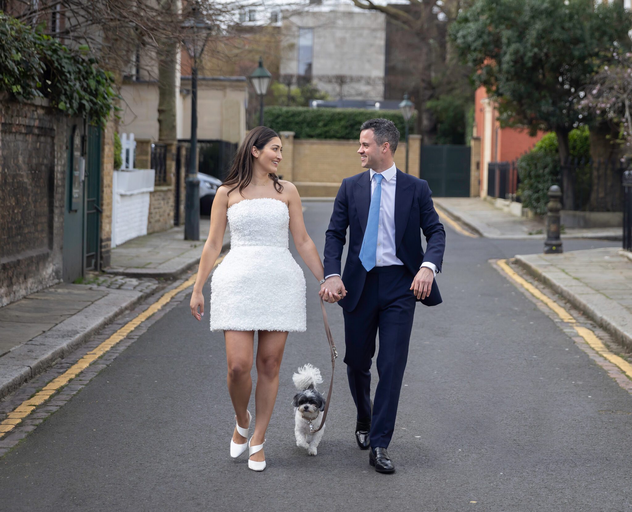 Bride and groom with dog in street Chelsea Old Town Hall Wedding
