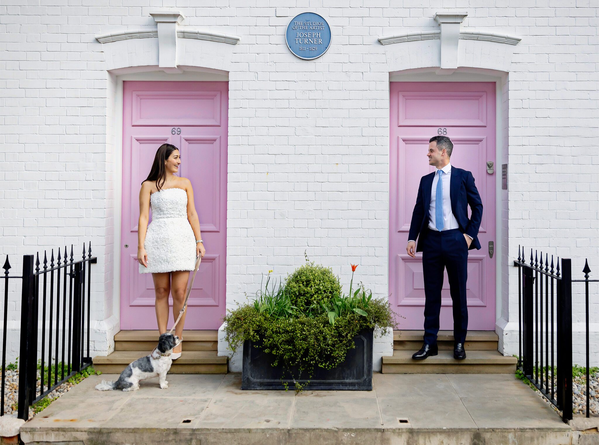 Chelsea Old Town Hall Wedding couple by pink doors