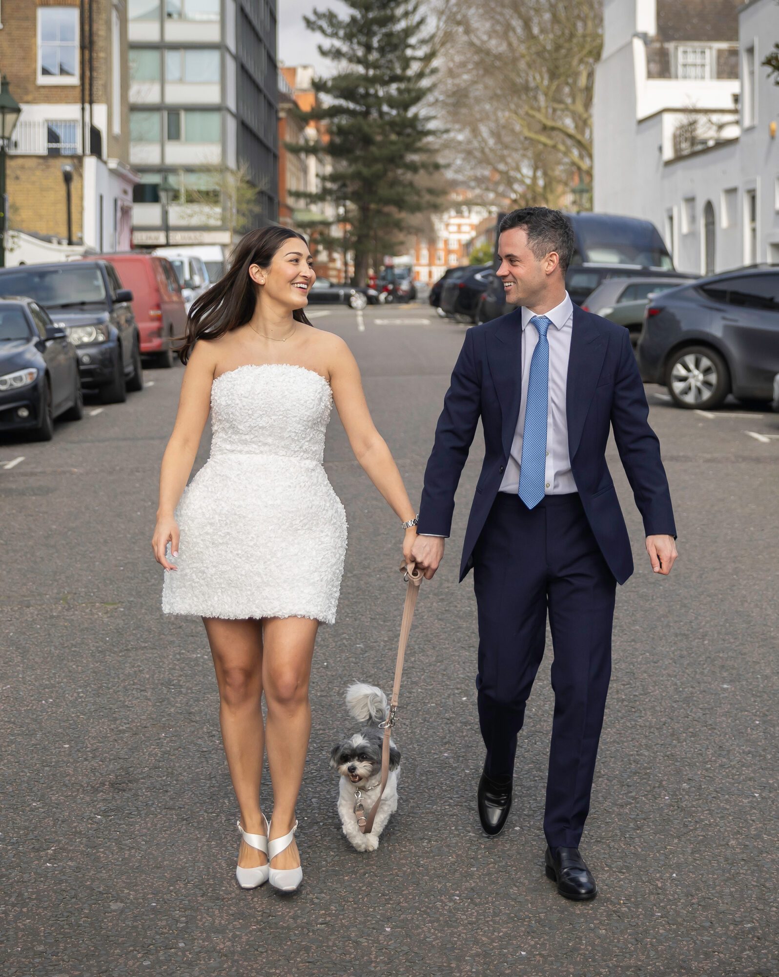 Chelsea Old Town Hall wedding couple walking with dog