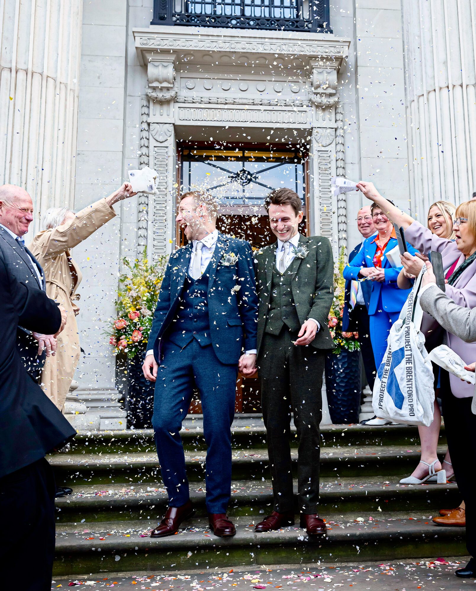 Confetti throw two grooms Old Marylebone Town Hall wedding