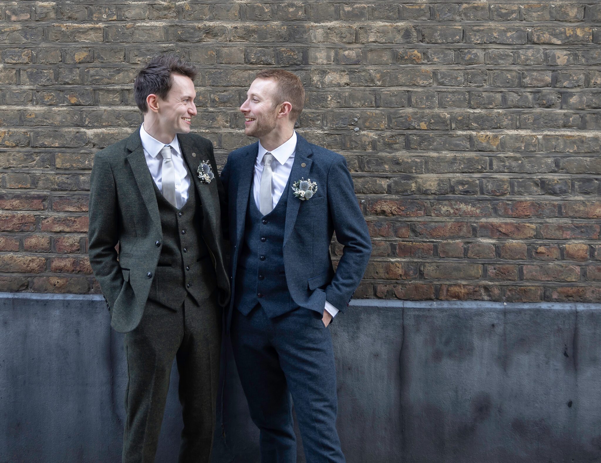 Groom and groom chat by Marylebone wall London