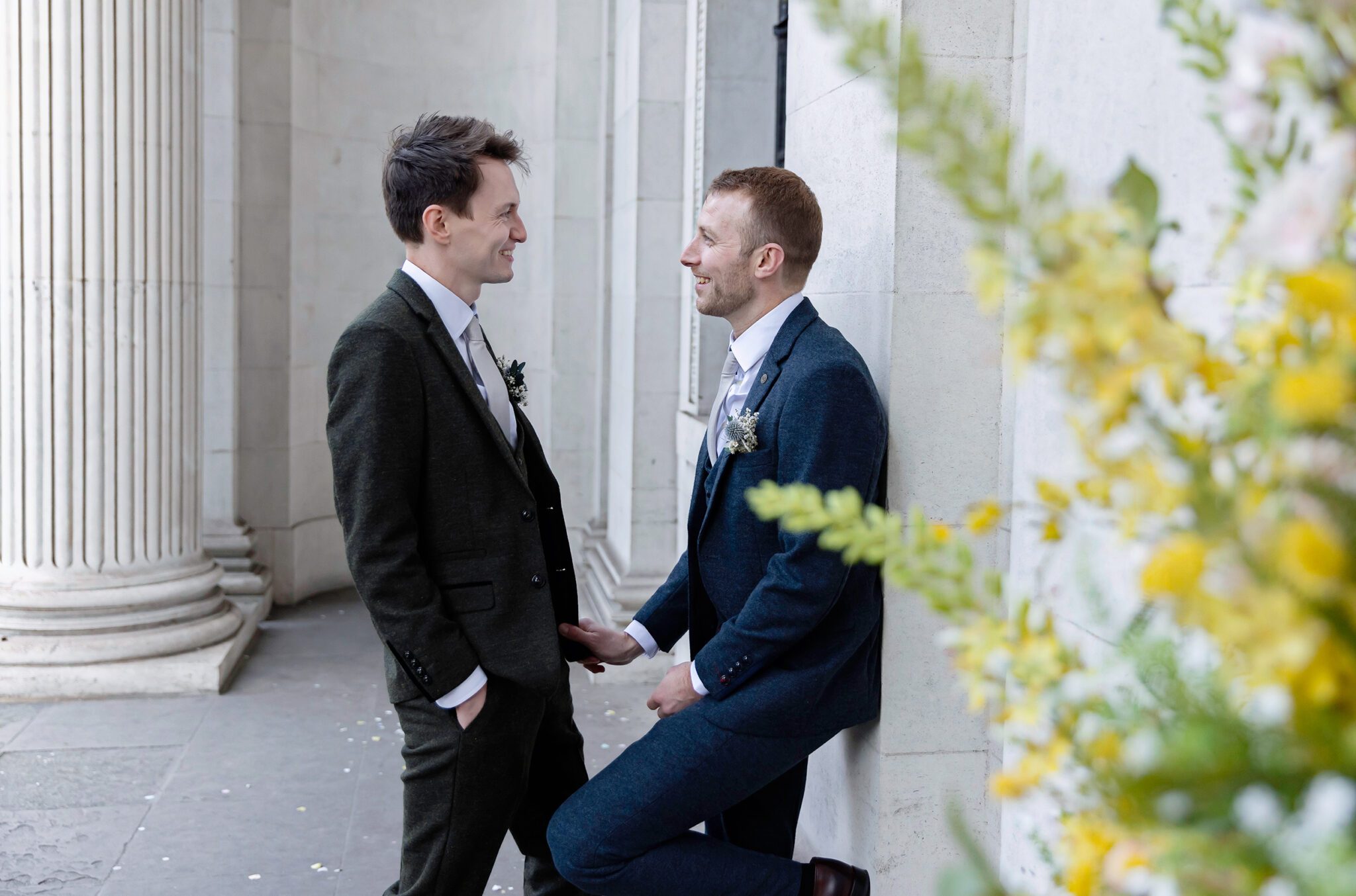 Two grooms romantic moment at Old Marylebone Town Hall wedding