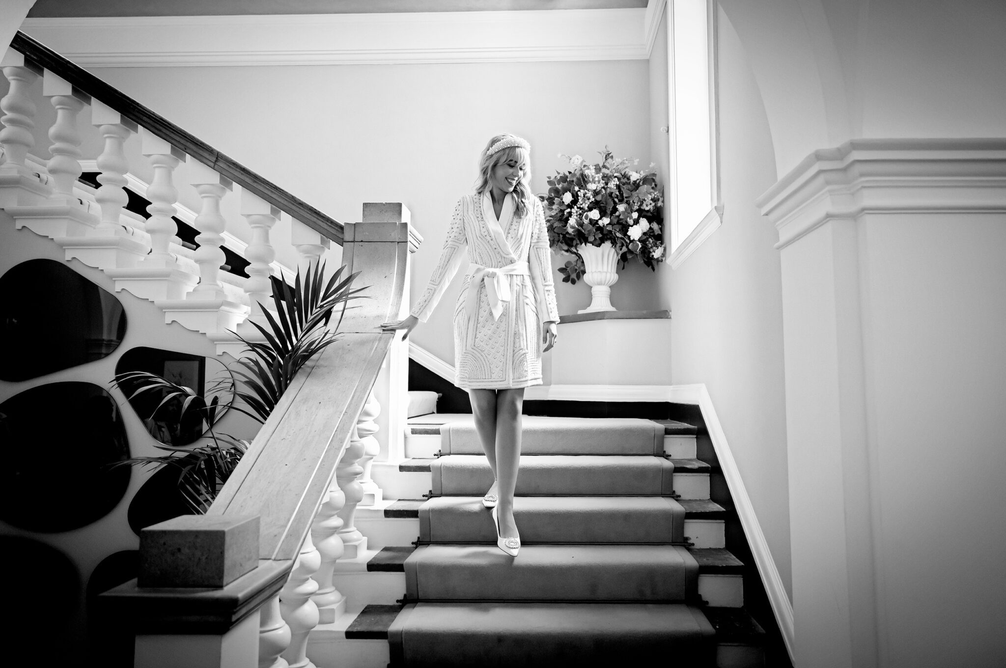 Bride comes down stairs Chelsea Old Town Hall wedding