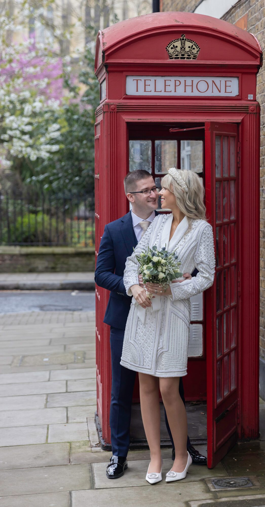 Chelsea Old Town Hall wedding couple in red phone box together