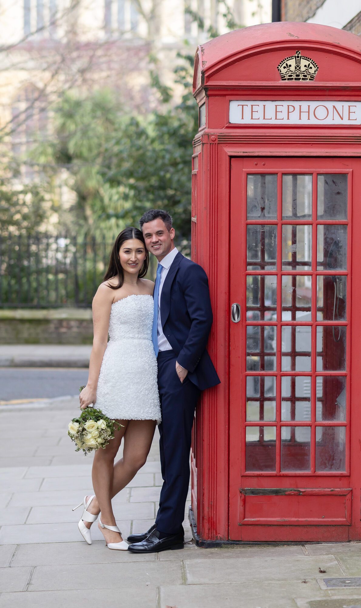 Chelsea Old Town Hall Wedding bride and groom by red phone box