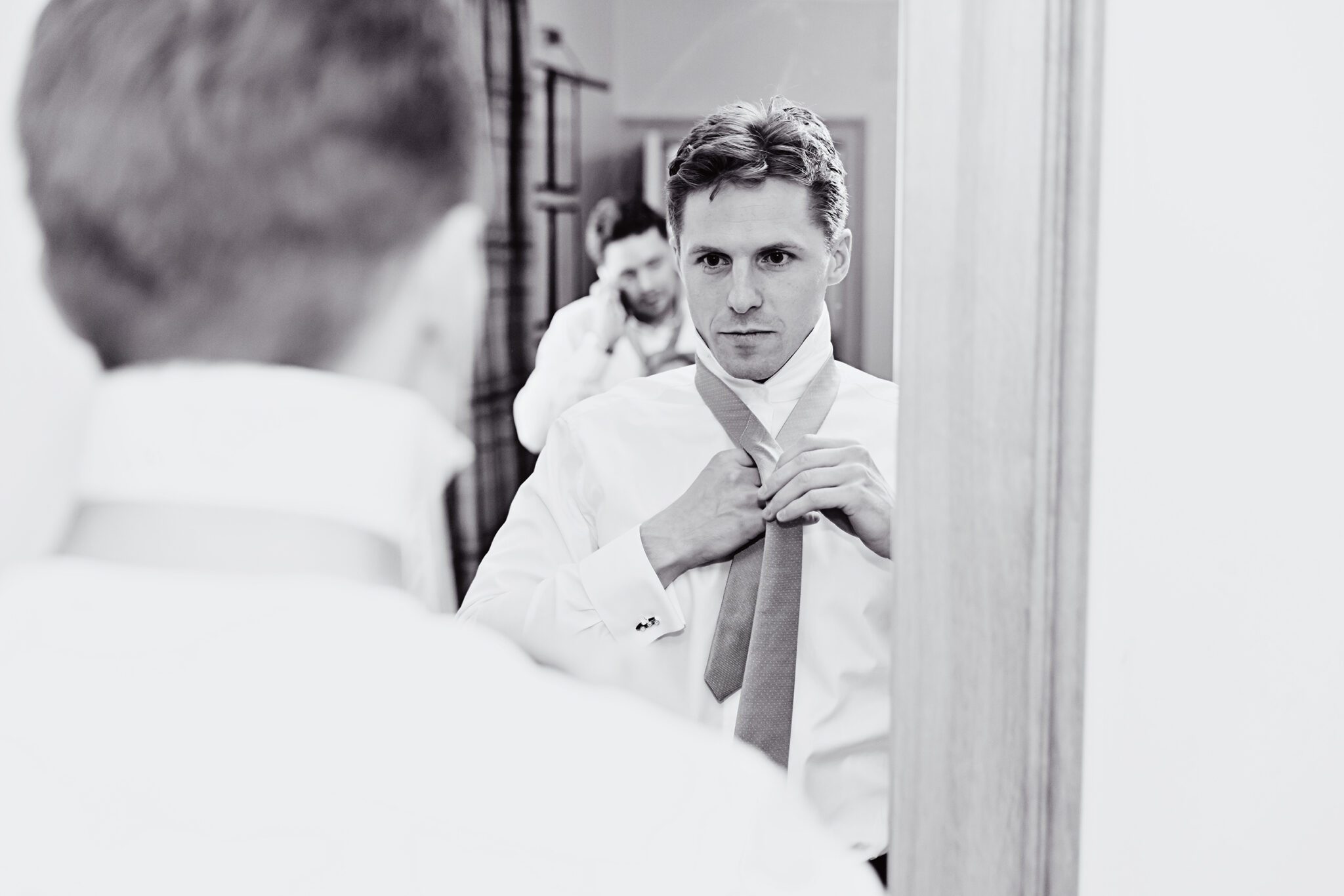 Groom mirror prep Wotton House wedding