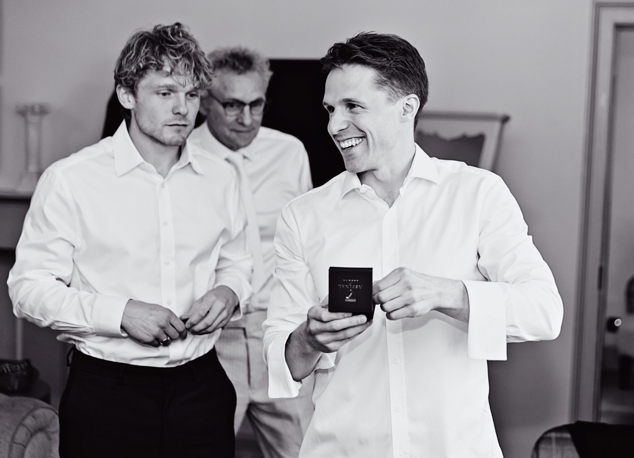 Smiling groom during prep Wotton House wedding day