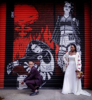 Bride and groom by graffiti Old Timber Store wedding