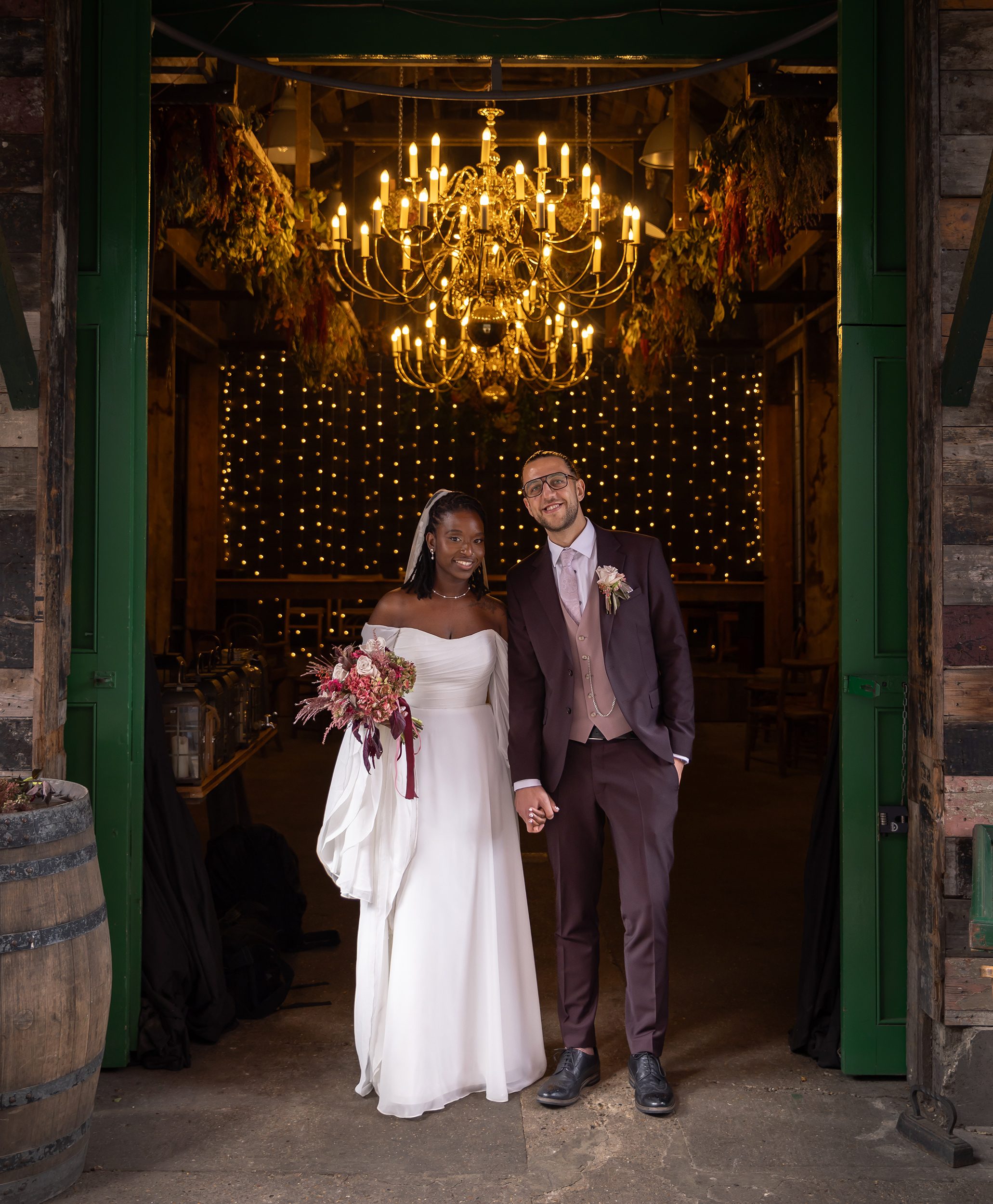 Bride and groom doorway The Old Timber Store wedding