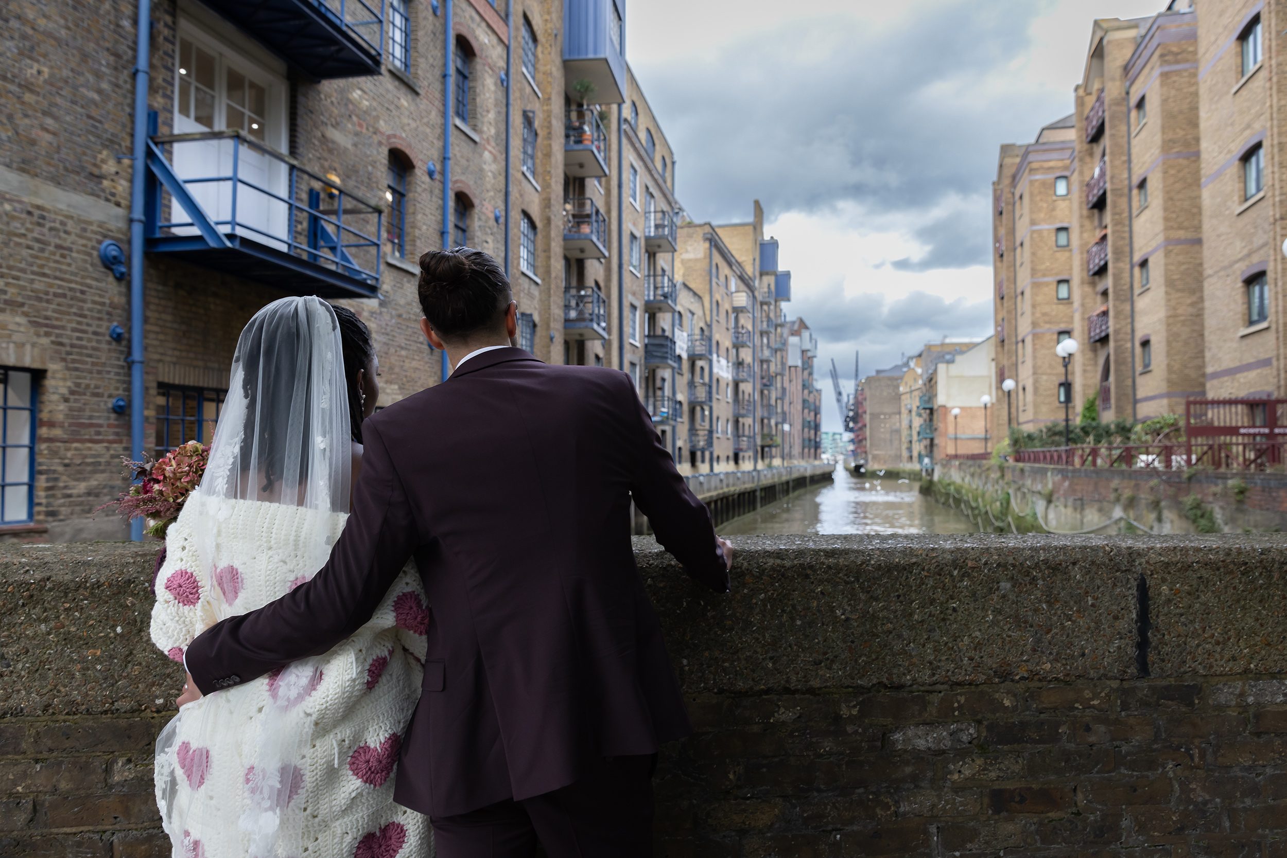 Bride and groom look across the Thames London