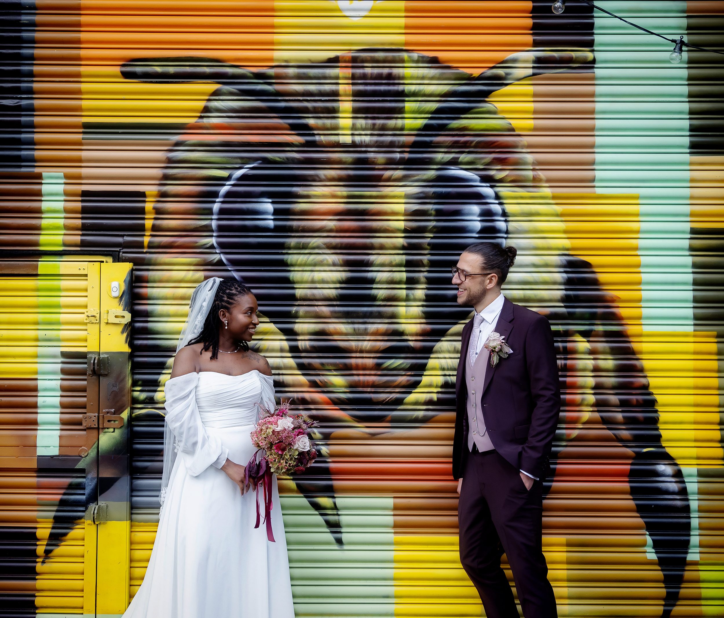 Old Timber Store wedding couple by roller doors London