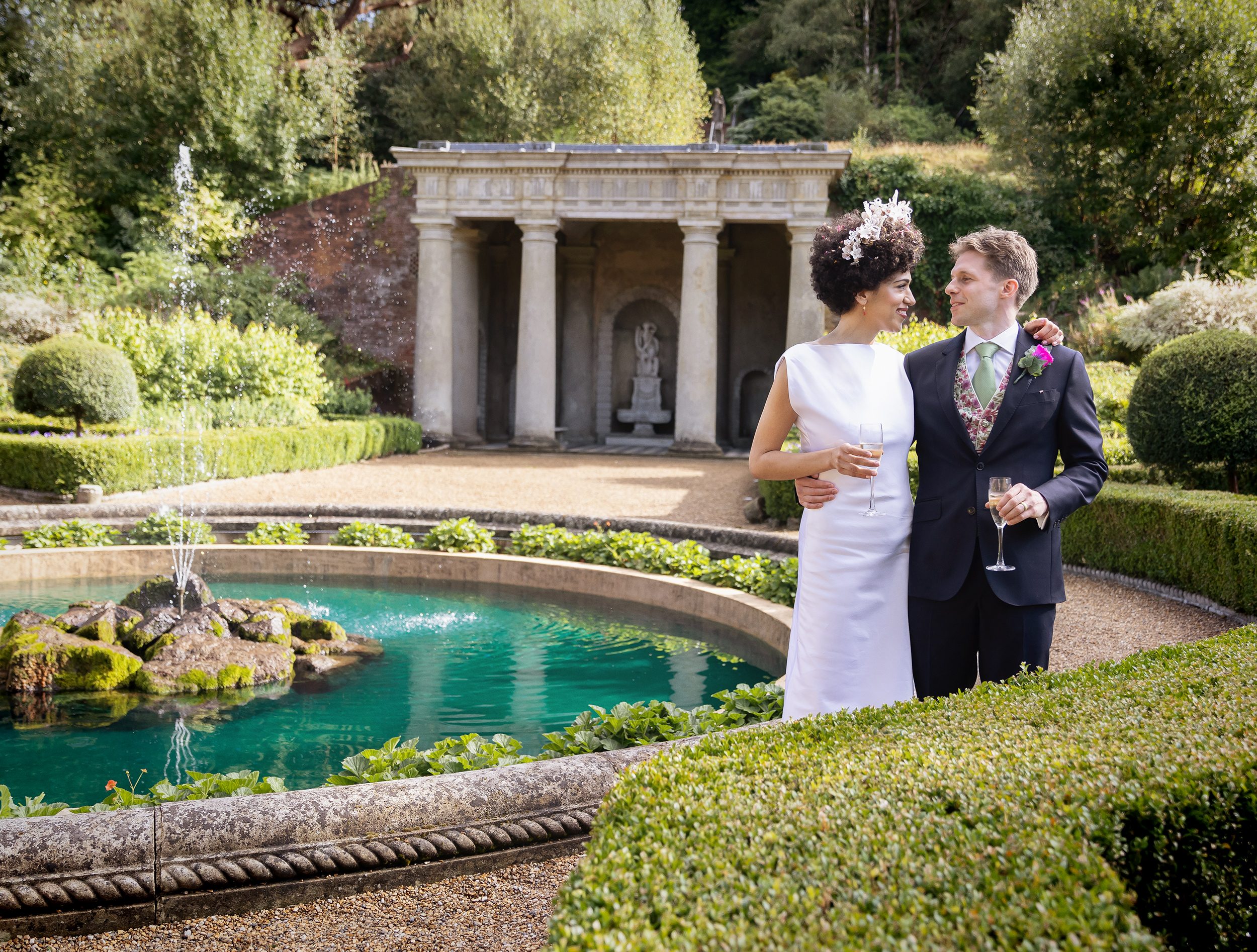 Bride and groom by fountain at Wotton House Wedding