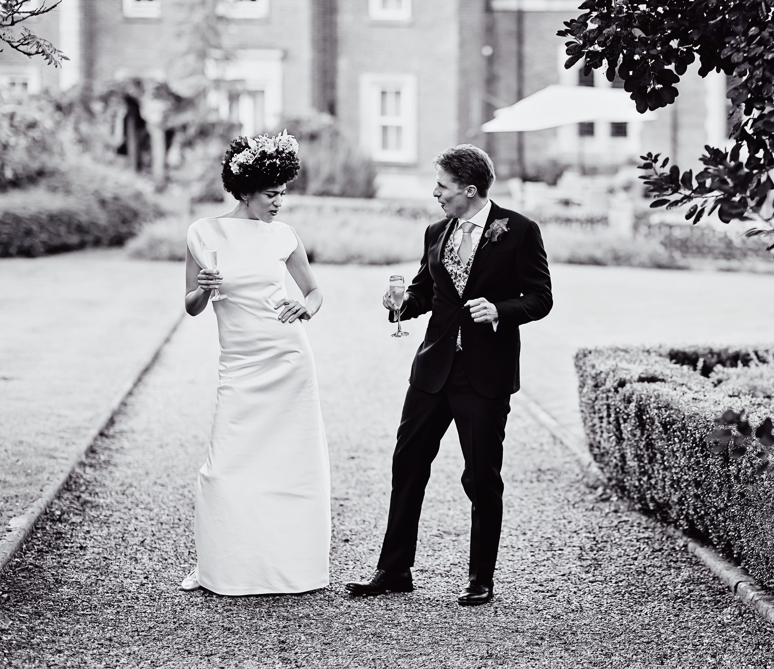 Bride and groom dance in grounds of Wotton House