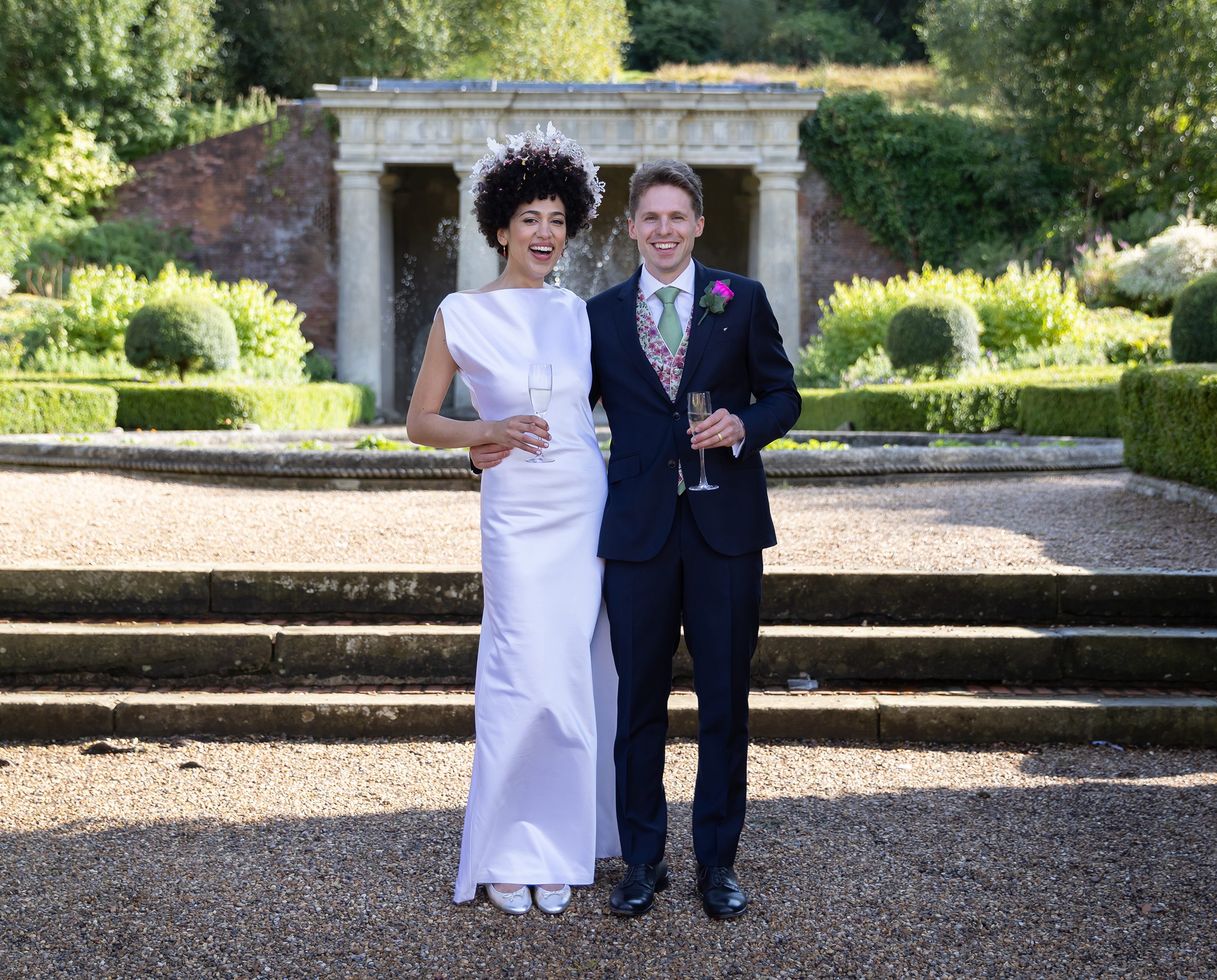 Happy wedding couple outside at Wotton House