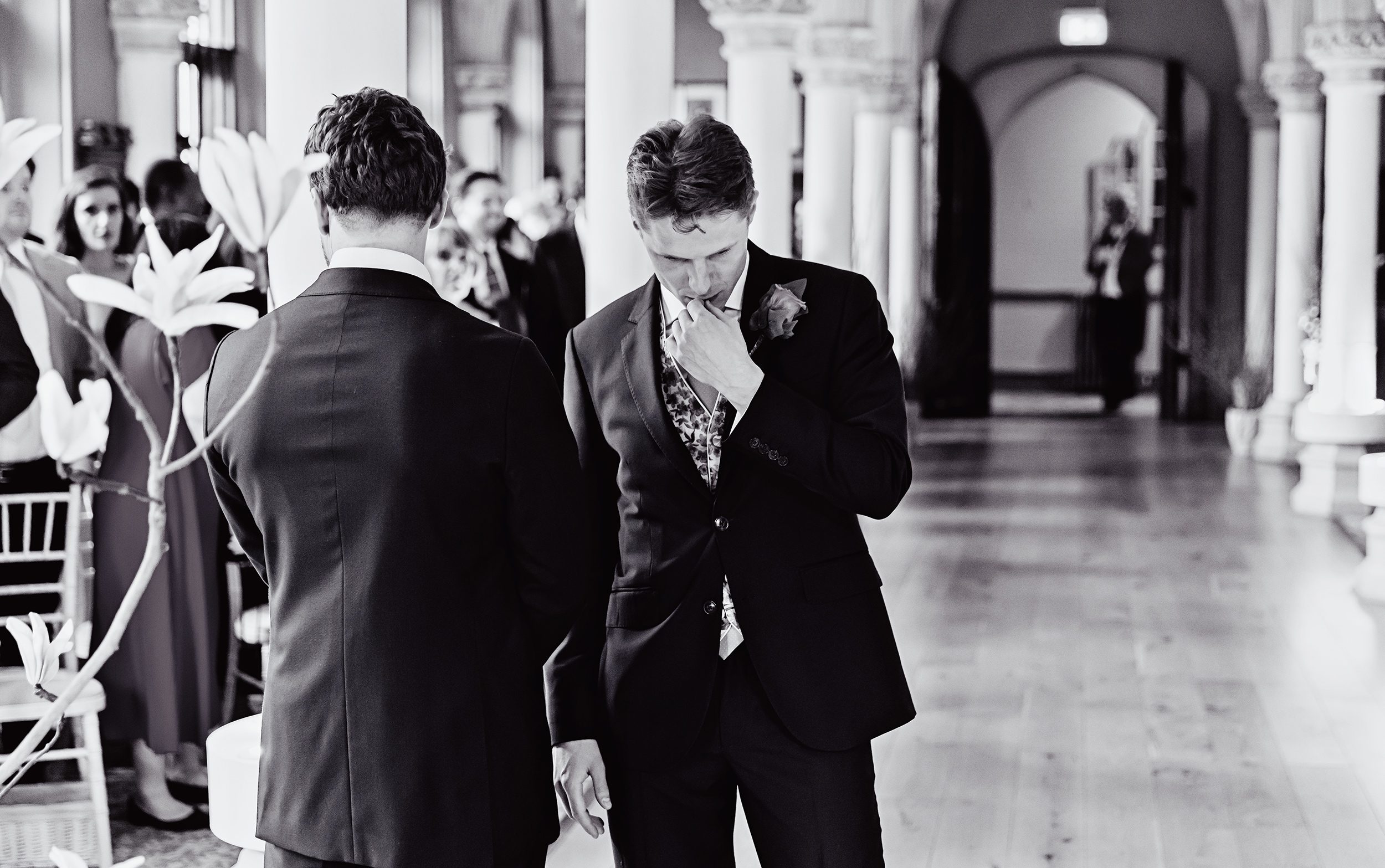 Pensive groom waits for bride Wotton House wedding ceremony