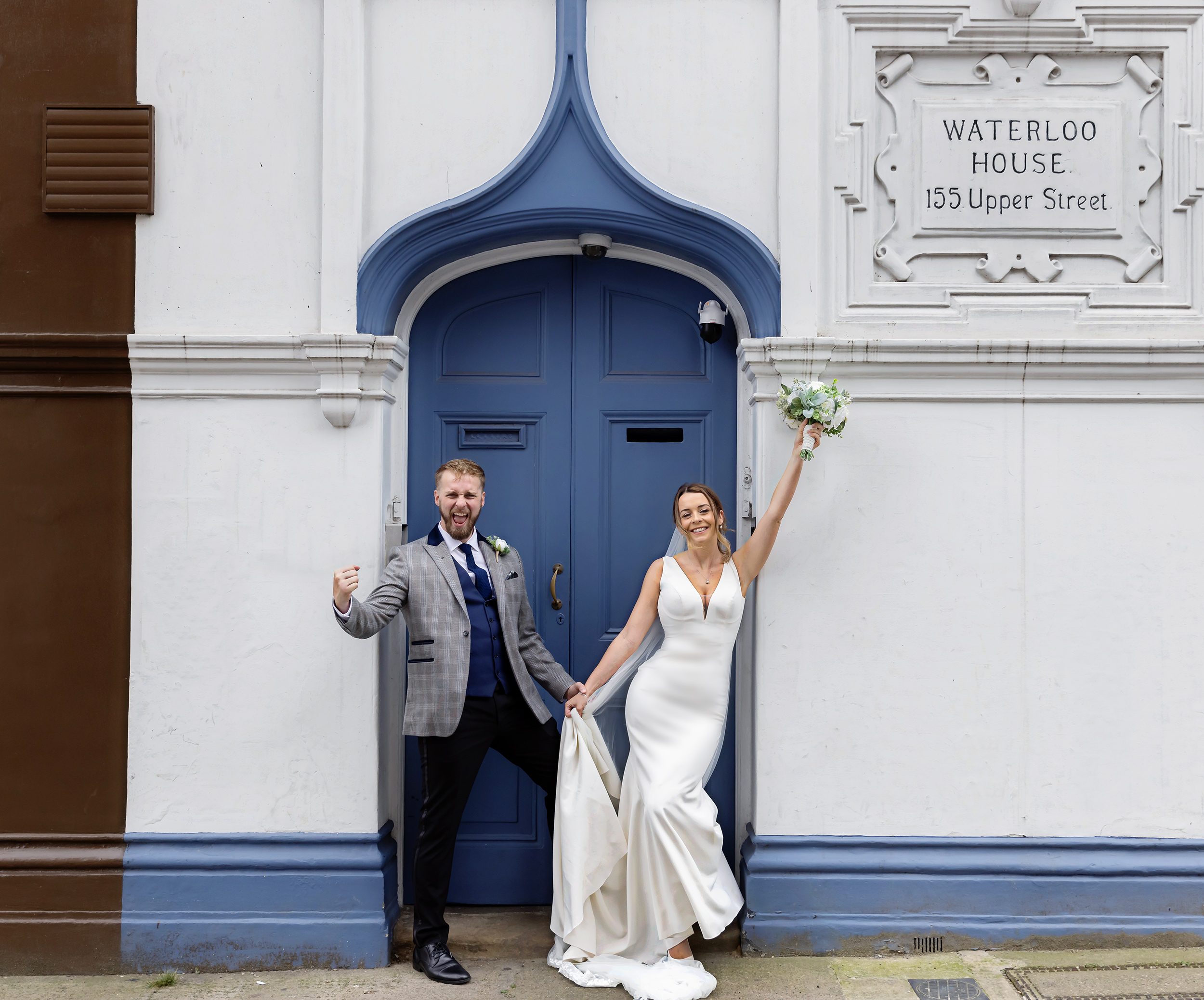 Bride and groom celebrate on Upper Street Islington