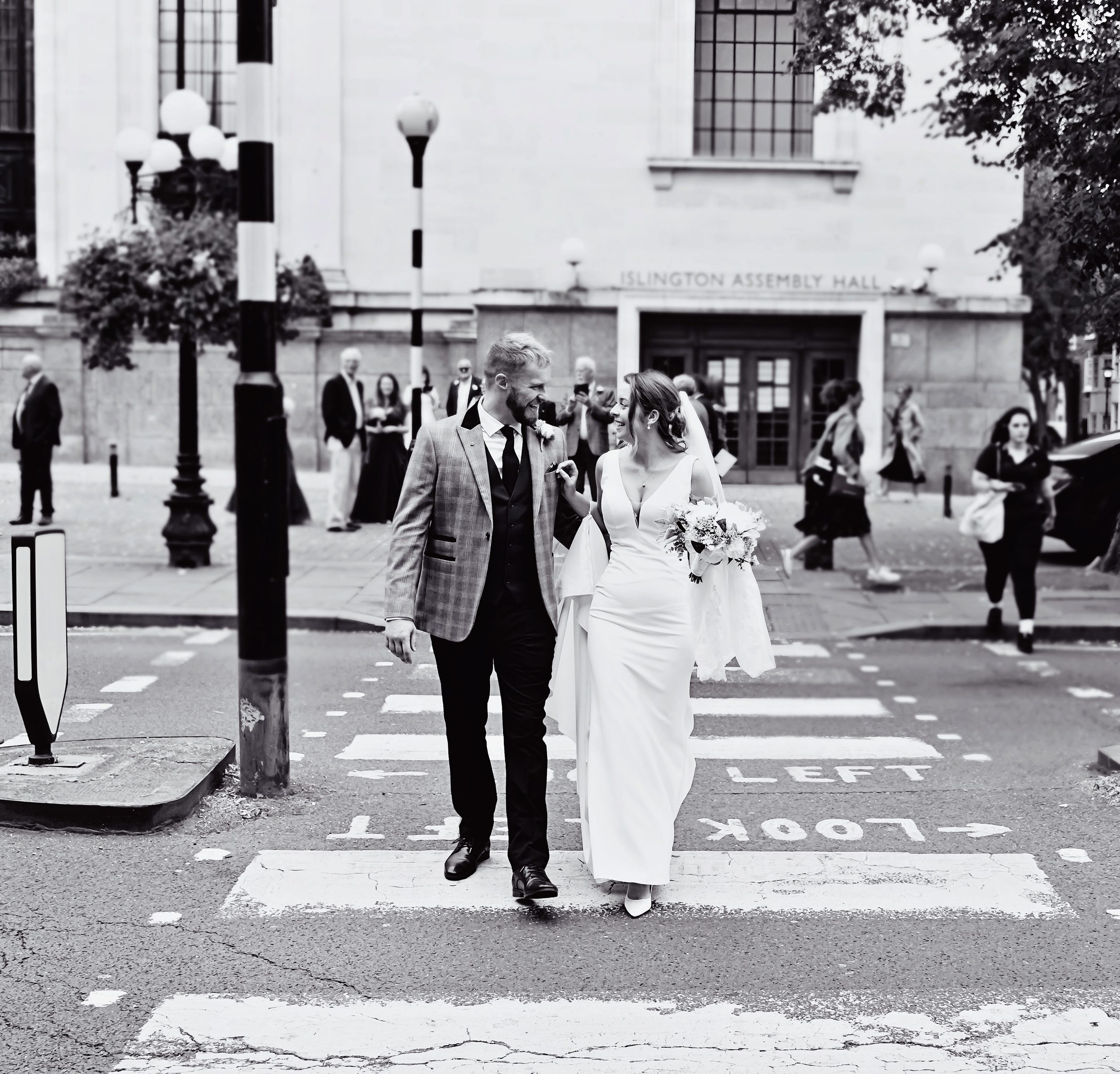 Bride and groom crossing Upper Street Islington Wedding