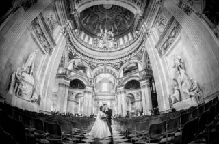 Bride and groom kiss at St Paul's Cathedral Wedding