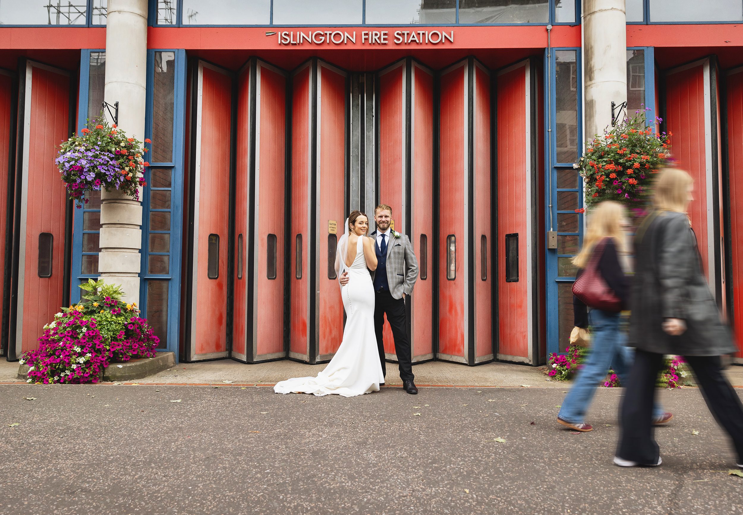 Bride and groom outside Islington Fire Station after wedding