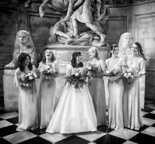 Bridesmaids laughing together inside St Paul's Cathedral wedding