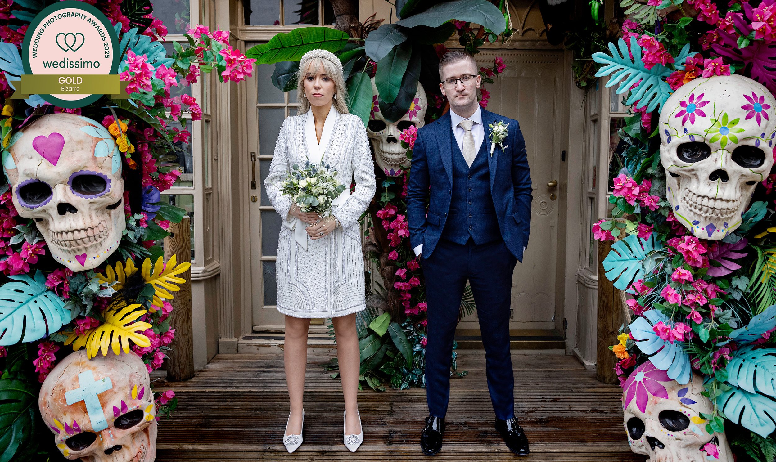 Chelsea Old Town Hall Wedding couple stand by Mexican skulls Kings Road Wedissimo winner