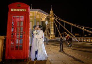 Chelsea Wedding couple kiss on Albert Bridge London