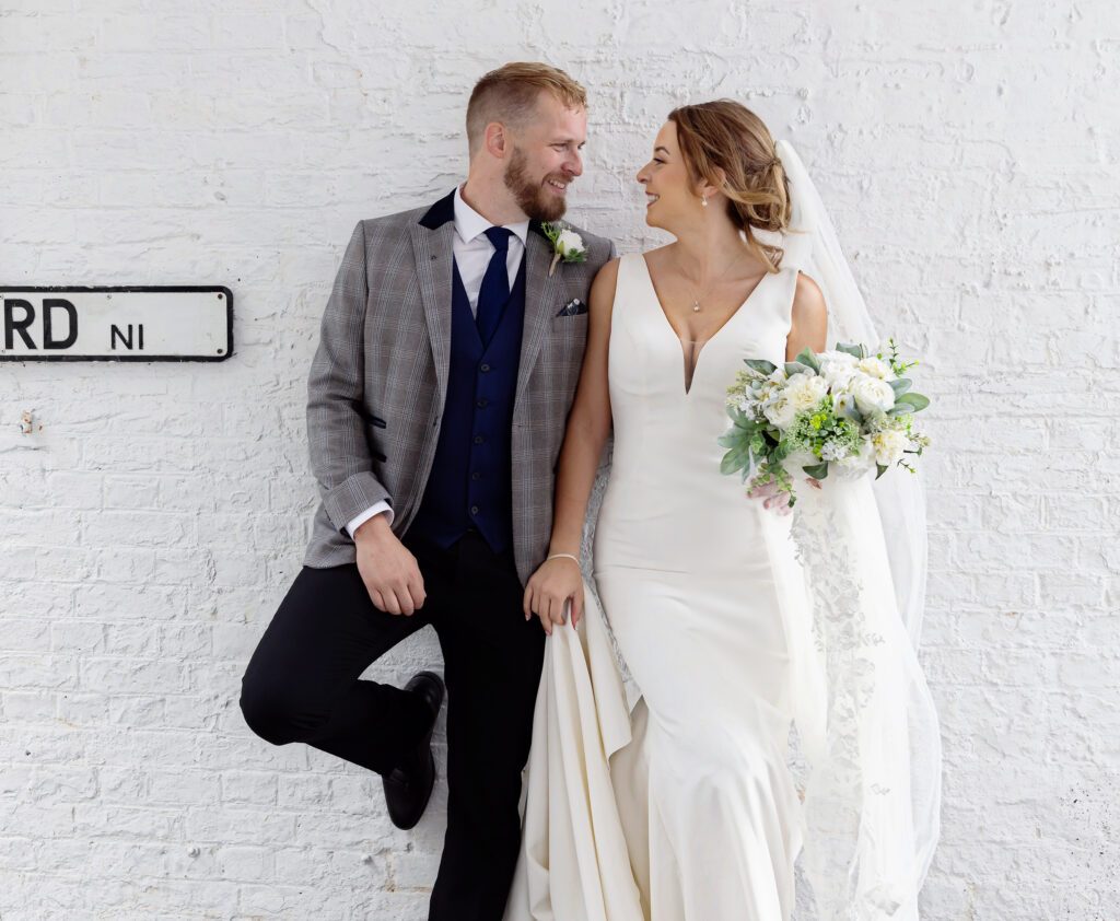 Islington Town Hall wedding couple by white wall image