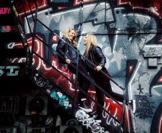 Shoreditch engagement couple on steps and graffiti