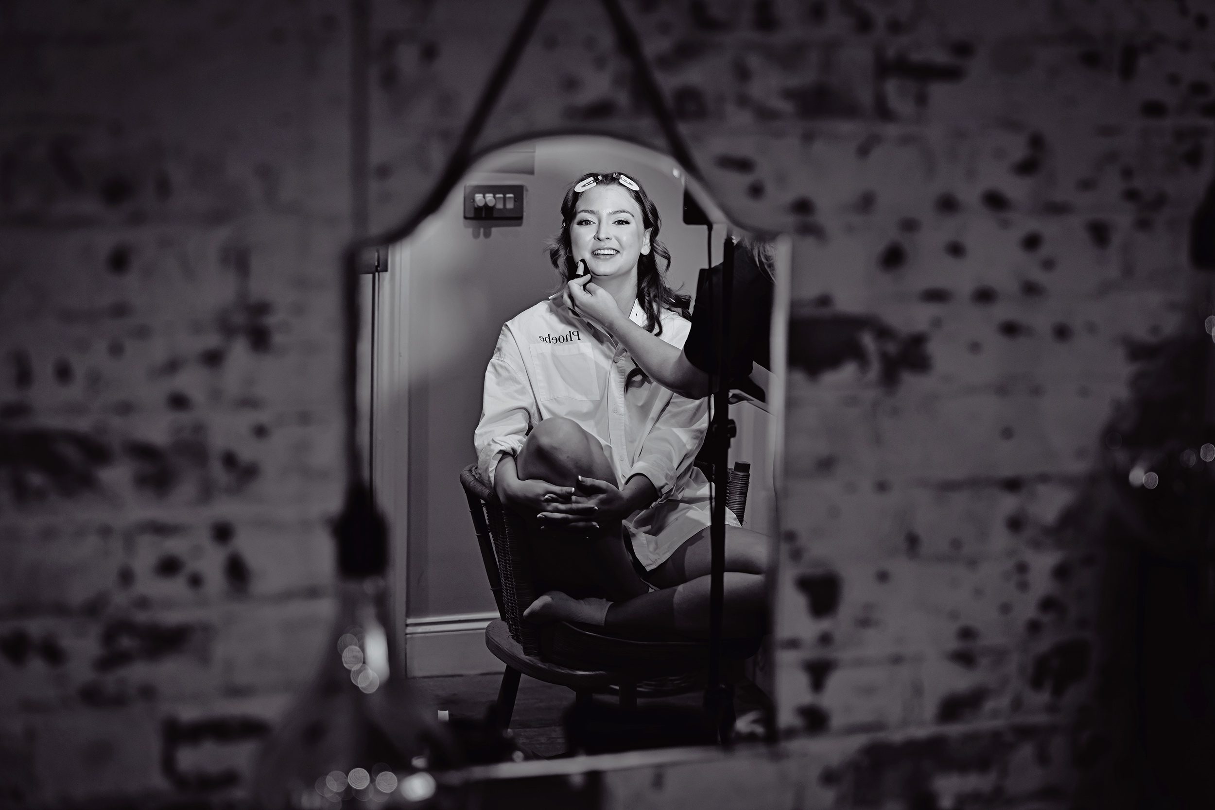 Bridal makeup image in mirror Stanlake Park wedding morning