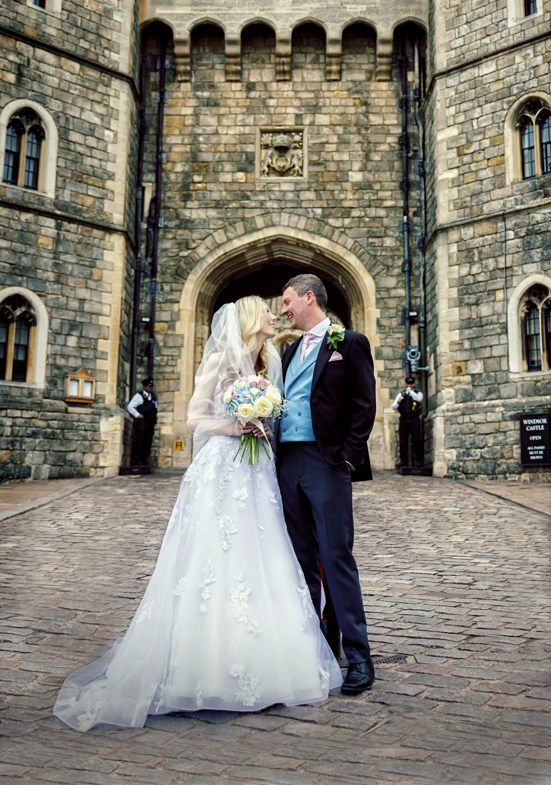 Bride and groom in front of Windsor Castle after wedding