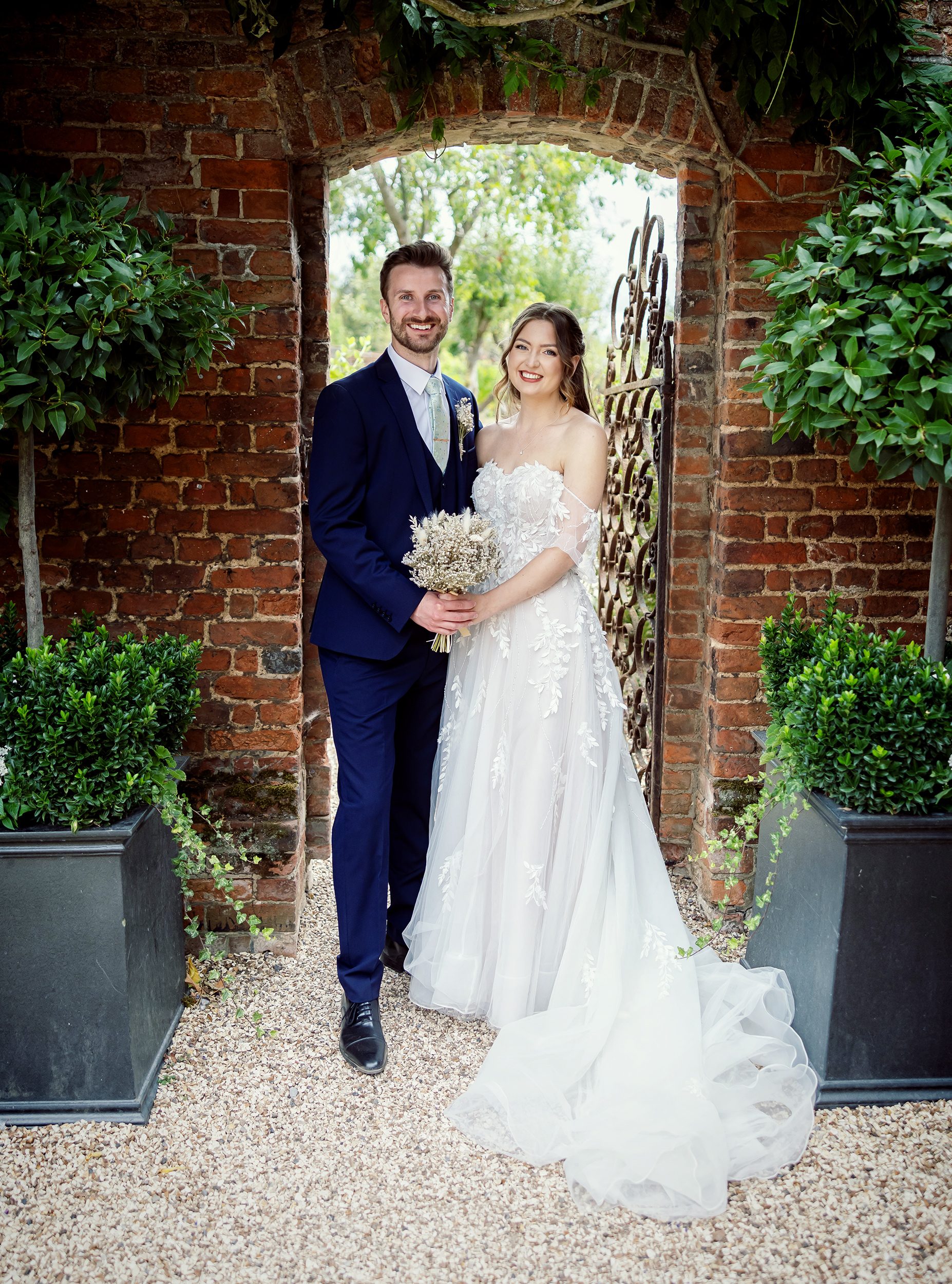 Bride and groom in garden doorway Stanlake Park Wedding
