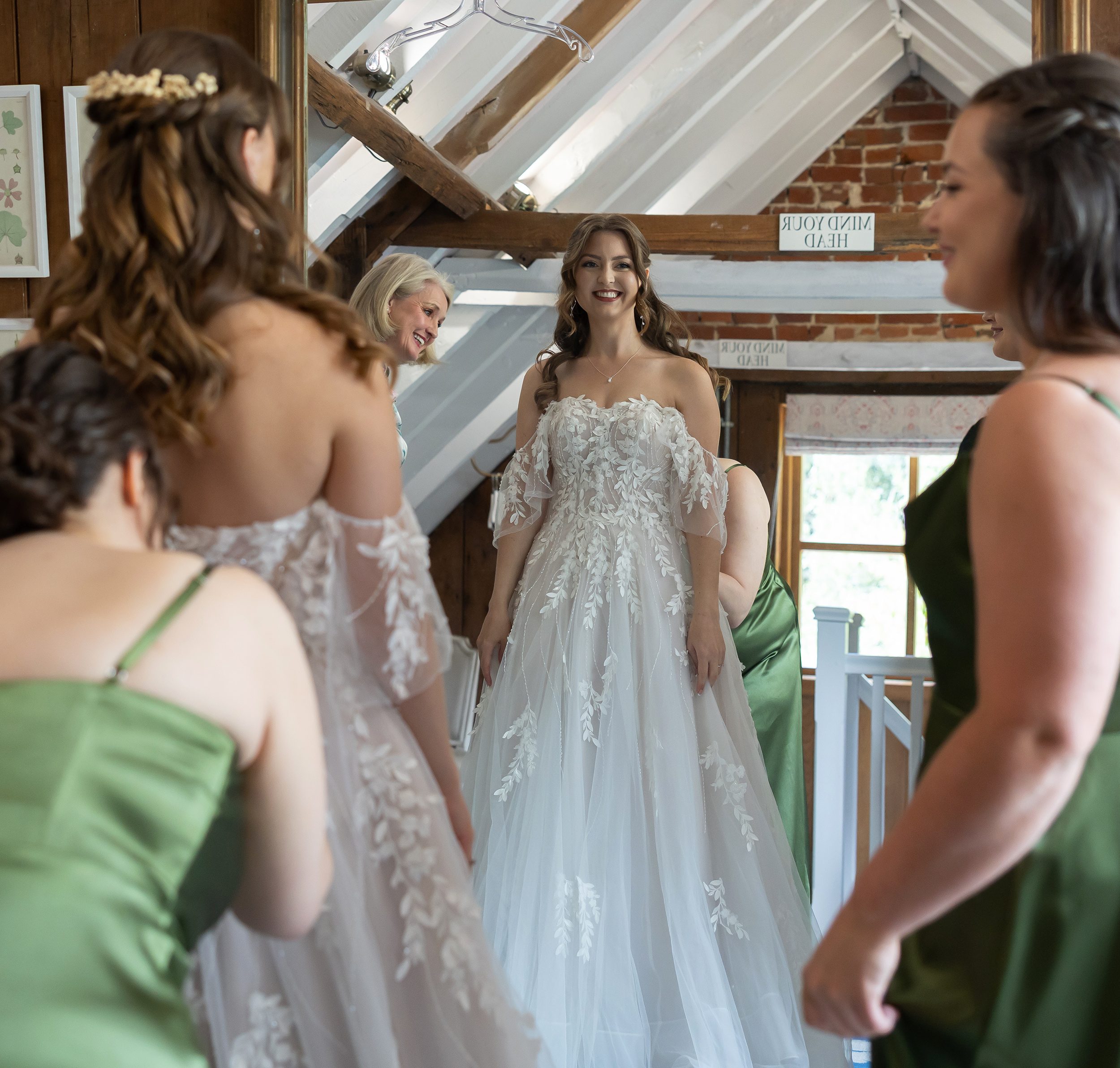 Bride with bridesmaids getting ready at Stanlake Park