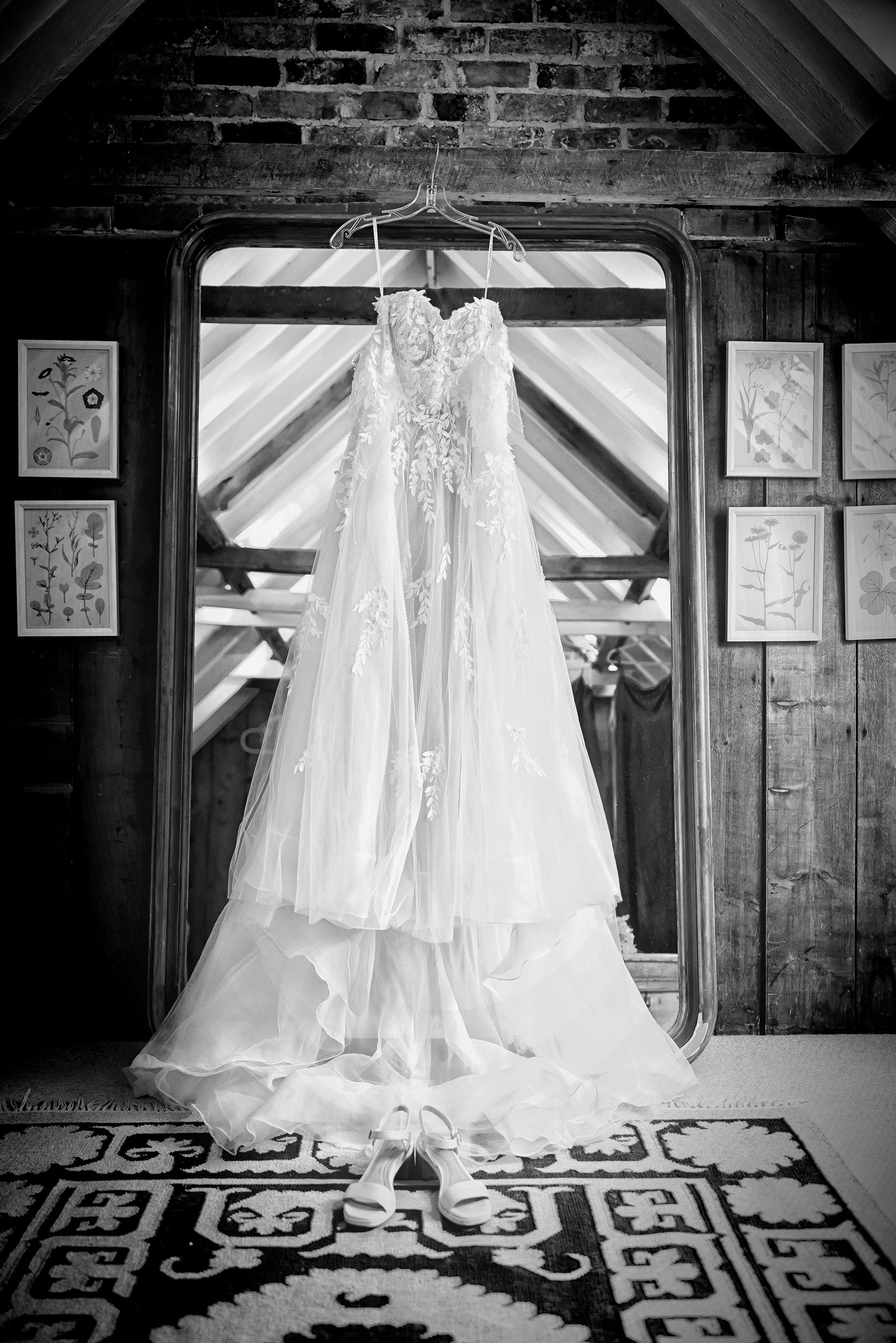 Dress hanging by mirror Stanlake Park Wedding prep