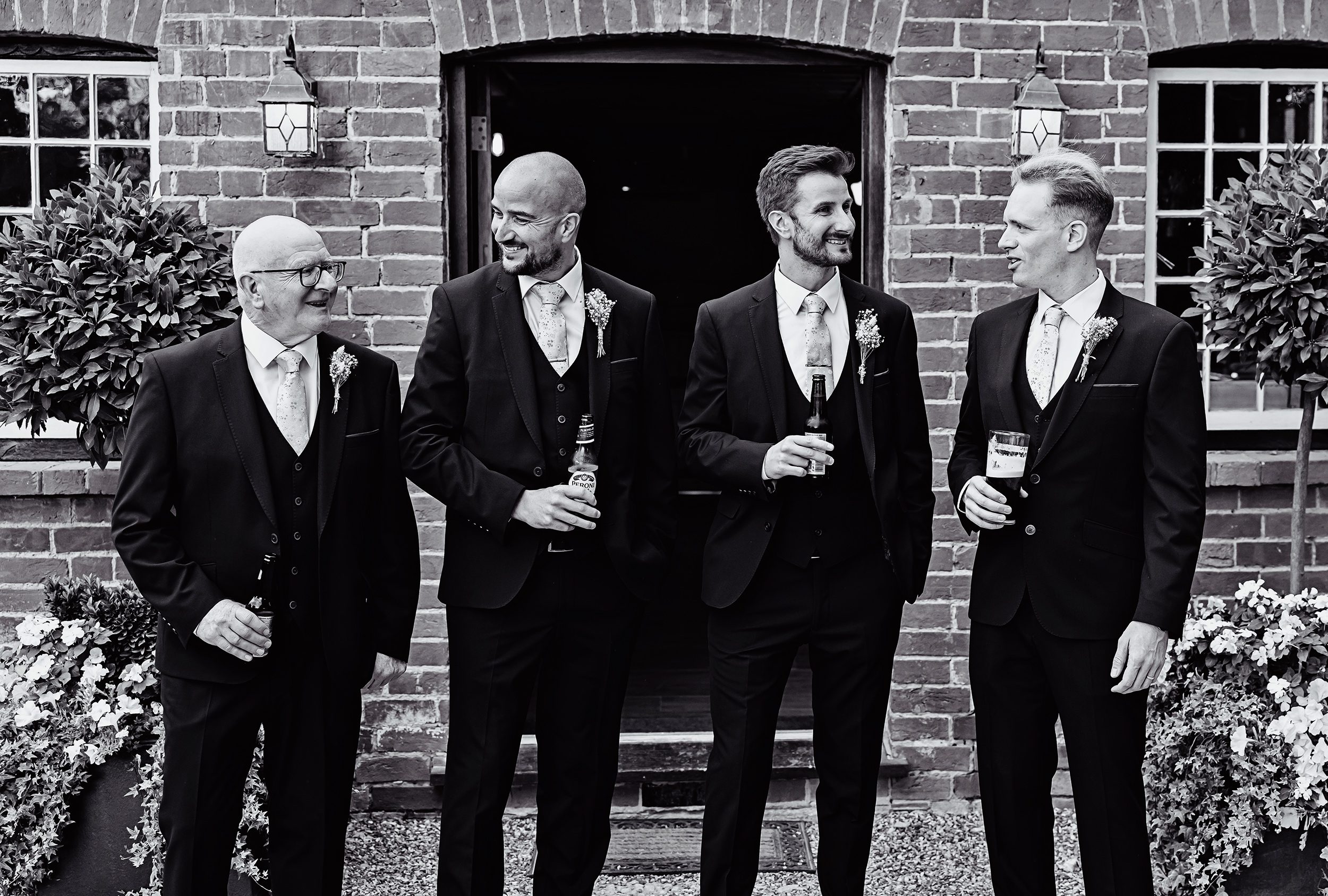 Groomsmen chatting before Stanlake Park wedding