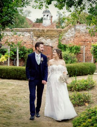 Stanlake Park Wedding bride and groom walking through grounds crop image