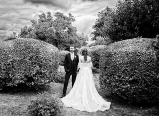 Stanlake Park wedding couple facing opposite ways in the grounds BW