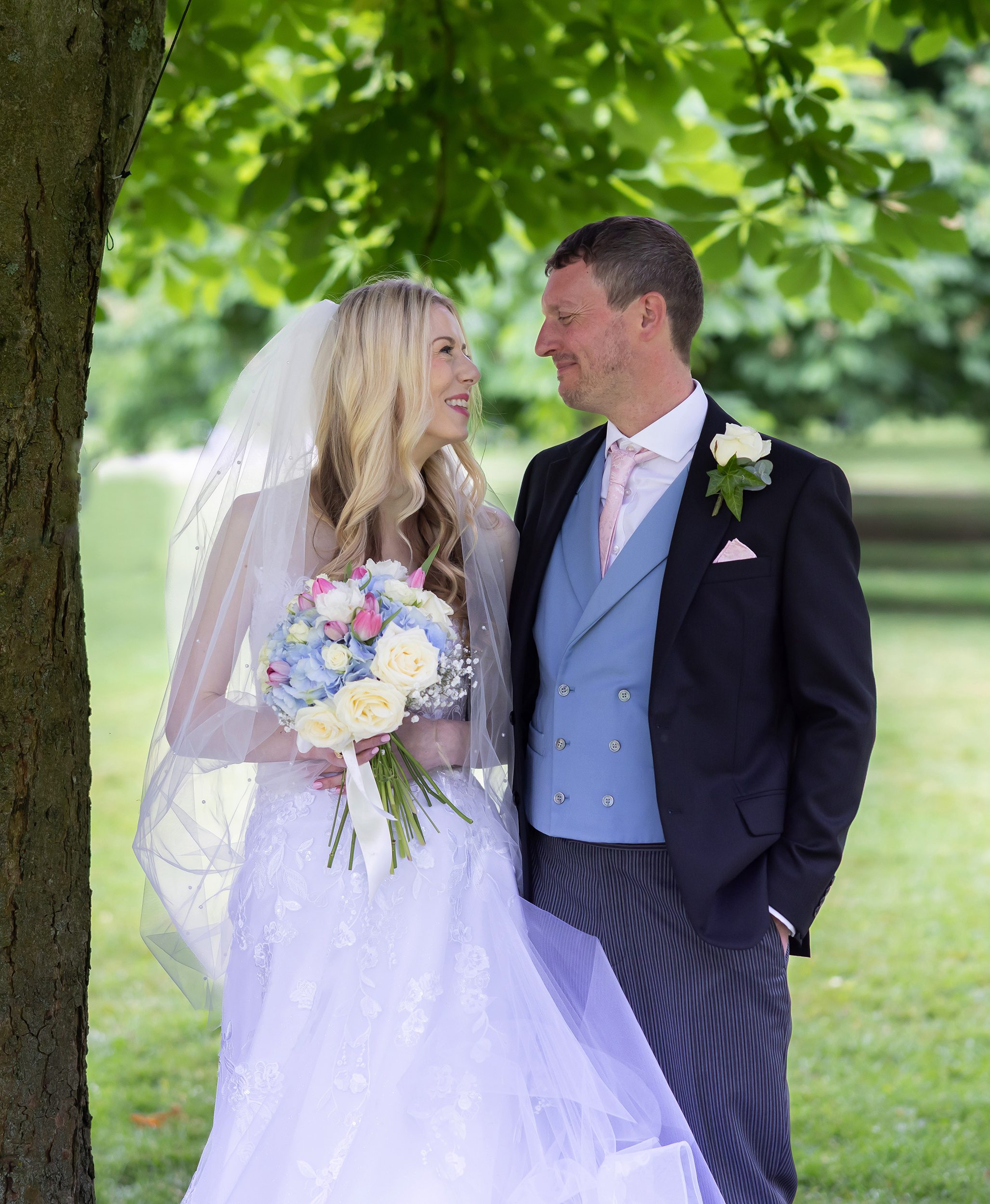 Windsor-wedding-couple-in-park-by-tree-image
