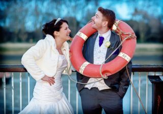 Bride-and-groom-with-lifebuoy-Thames-Rowing-Club