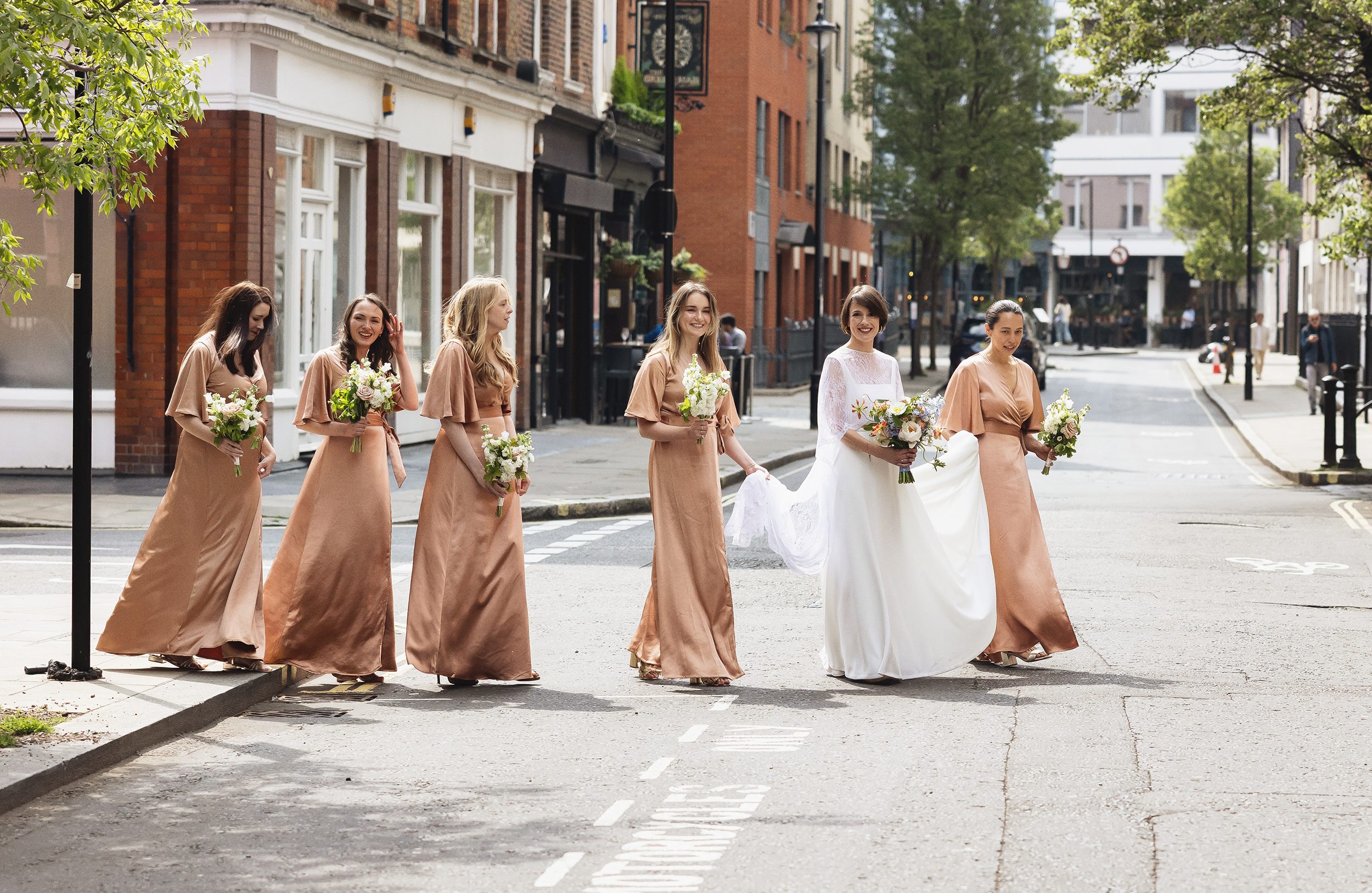 Bridal Party walk across road to Fitzrovia Chapel