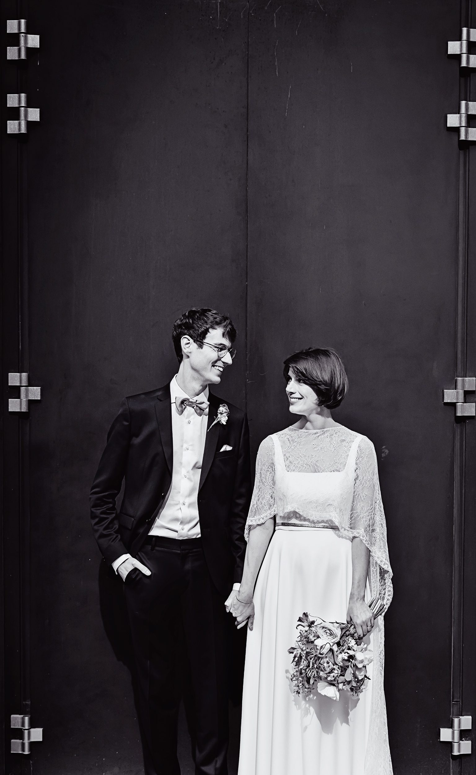 Bride and groom in front of Fitzrovia iron doors